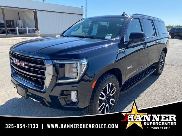 2024 GMC Yukon XL AT4 in Midnight Blue Metallic — front three-quarter view