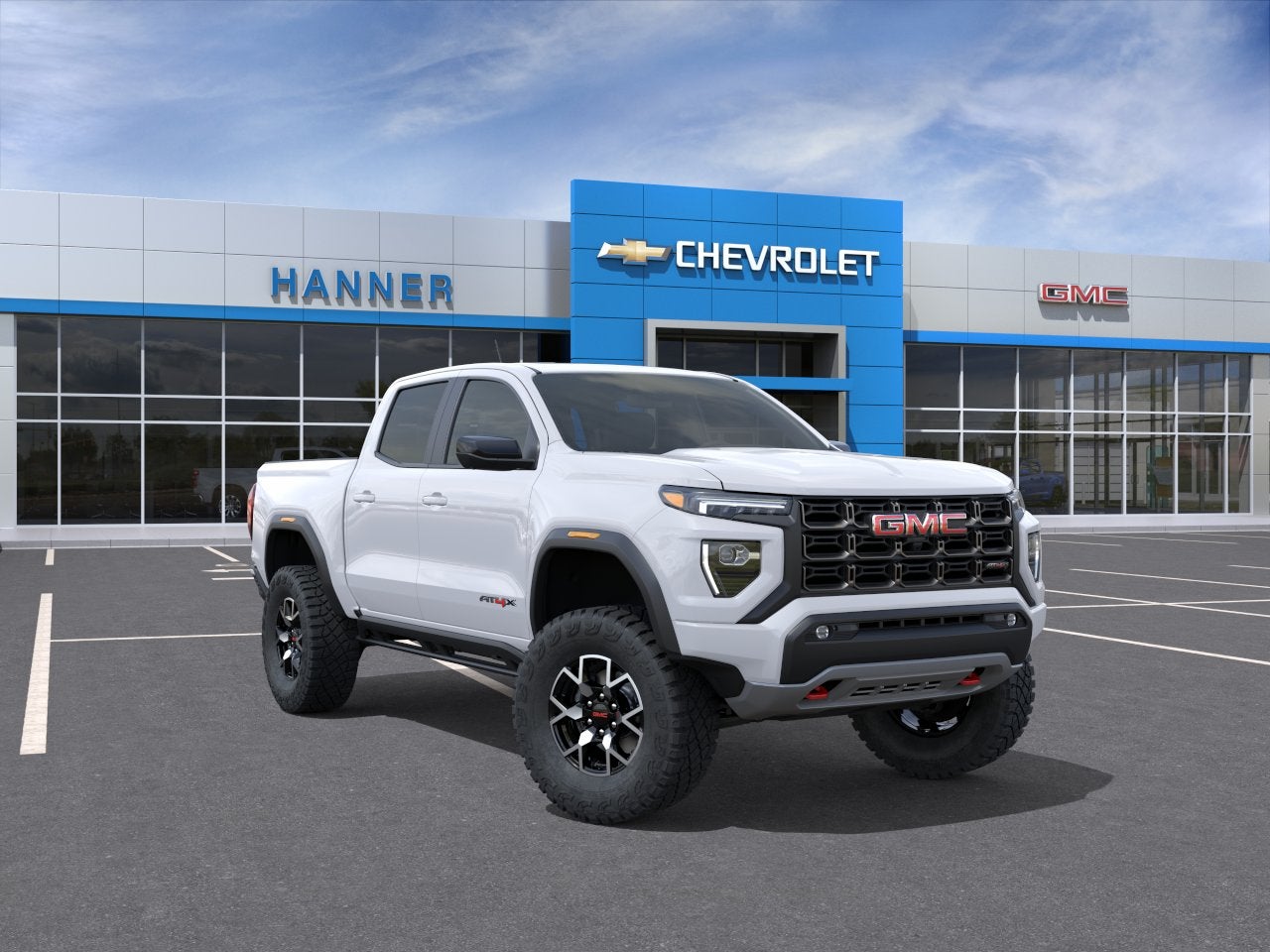 2026 GMC Canyon AT4X in Summit White — front three-quarter view