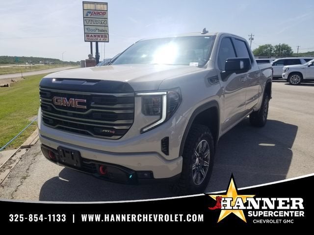 2026 GMC Sierra 1500 AT4 in Coastal Dune — front three-quarter view