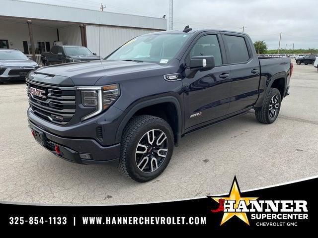 2025 GMC Sierra 1500 AT4 in Titanium Rush Metallic — front three-quarter view