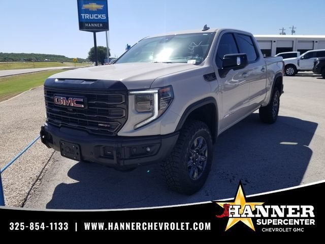 2026 GMC Sierra 1500 AT4X in Coastal Dune — front three-quarter view