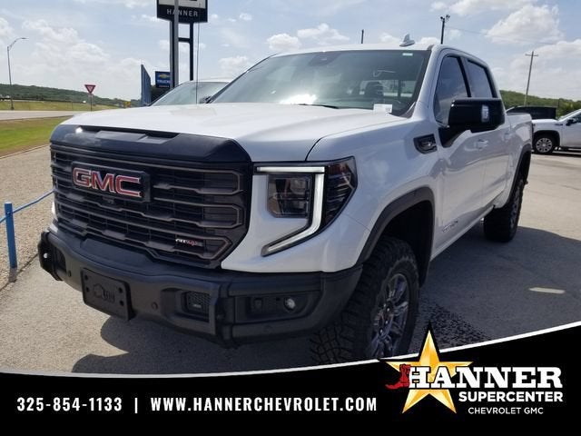 2026 GMC Sierra 1500 AT4X in Summit White — front three-quarter view